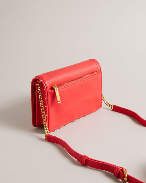 KAHNISA-goods-Carry around your card collection with KAHNISA. This leather purse has all of the card slots and zip compartments you'll ever need, with a fold over cover to keep them safe. The adjustable chain & leather shoulder strap allows for stylish carrying, finished with a studded trim for maximum style. Leather purse Studded trim Zip coin compartment Multiple card slots Foldover cover with magnetic fastening Adjustable chain and leather shoulder strap External zip pocket Dimensions: 10.5cm x 2.5cm- Te
